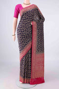 Navy Blue Banarasi Georgette Saree with Zari Butta on the body and Zari Border.  displayed on a mannequin