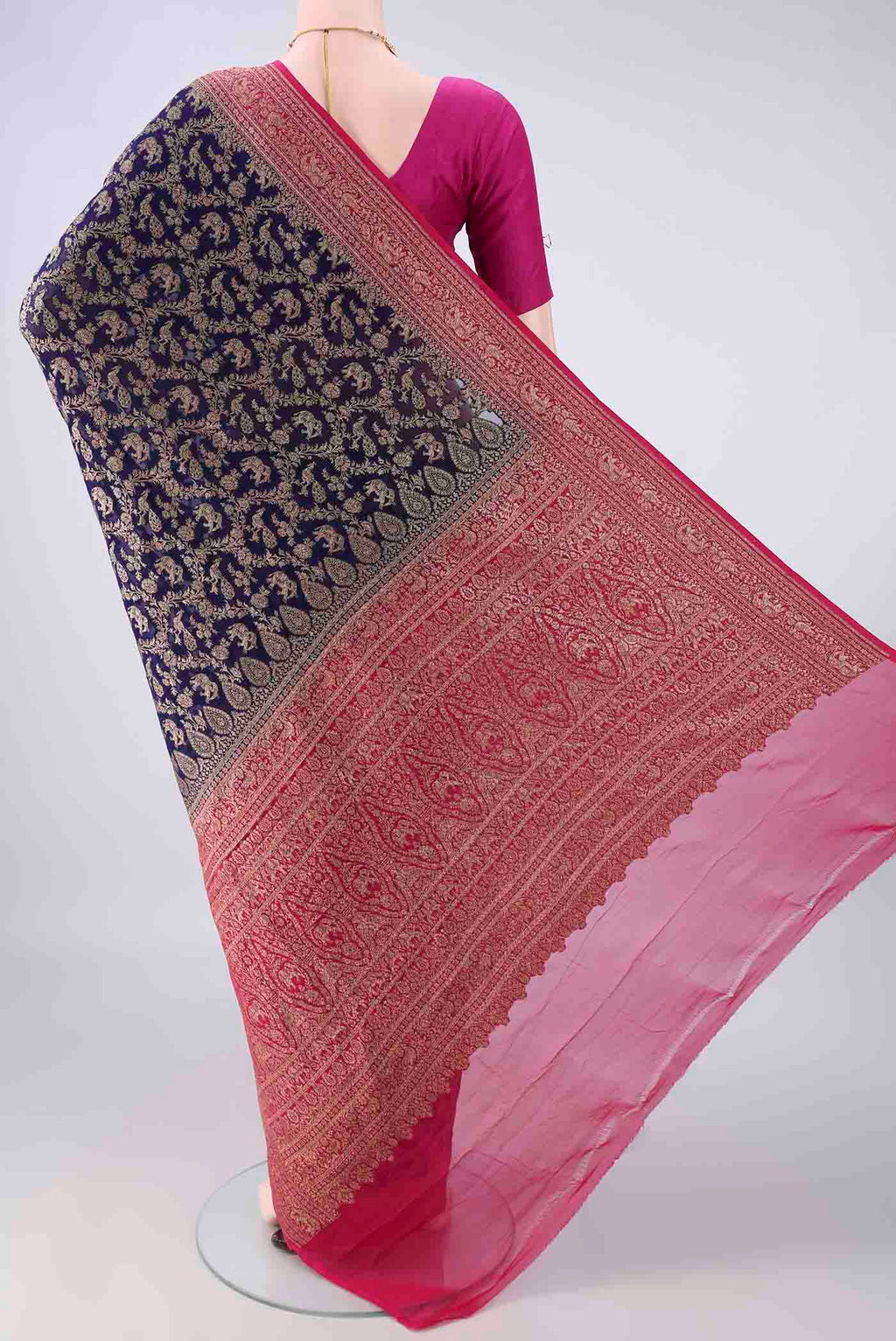 Flat view of Navy Blue Banarasi Georgette Saree with Zari Butta on the body and Zari Border. 