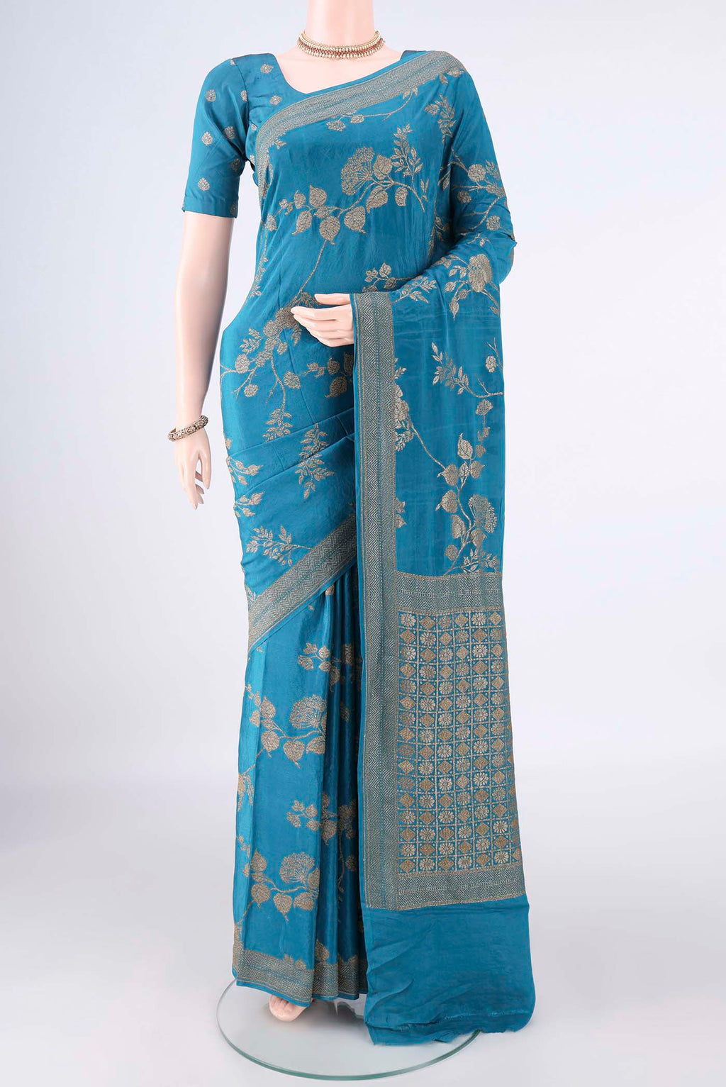 Pure Silk Blue Banarasi Georgette Saree with Zari Brocade on the body and Zari Border.  displayed on a mannequin