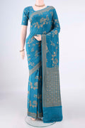 Pure Silk Blue Banarasi Georgette Saree with Zari Brocade on the body and Zari Border.  displayed on a mannequin