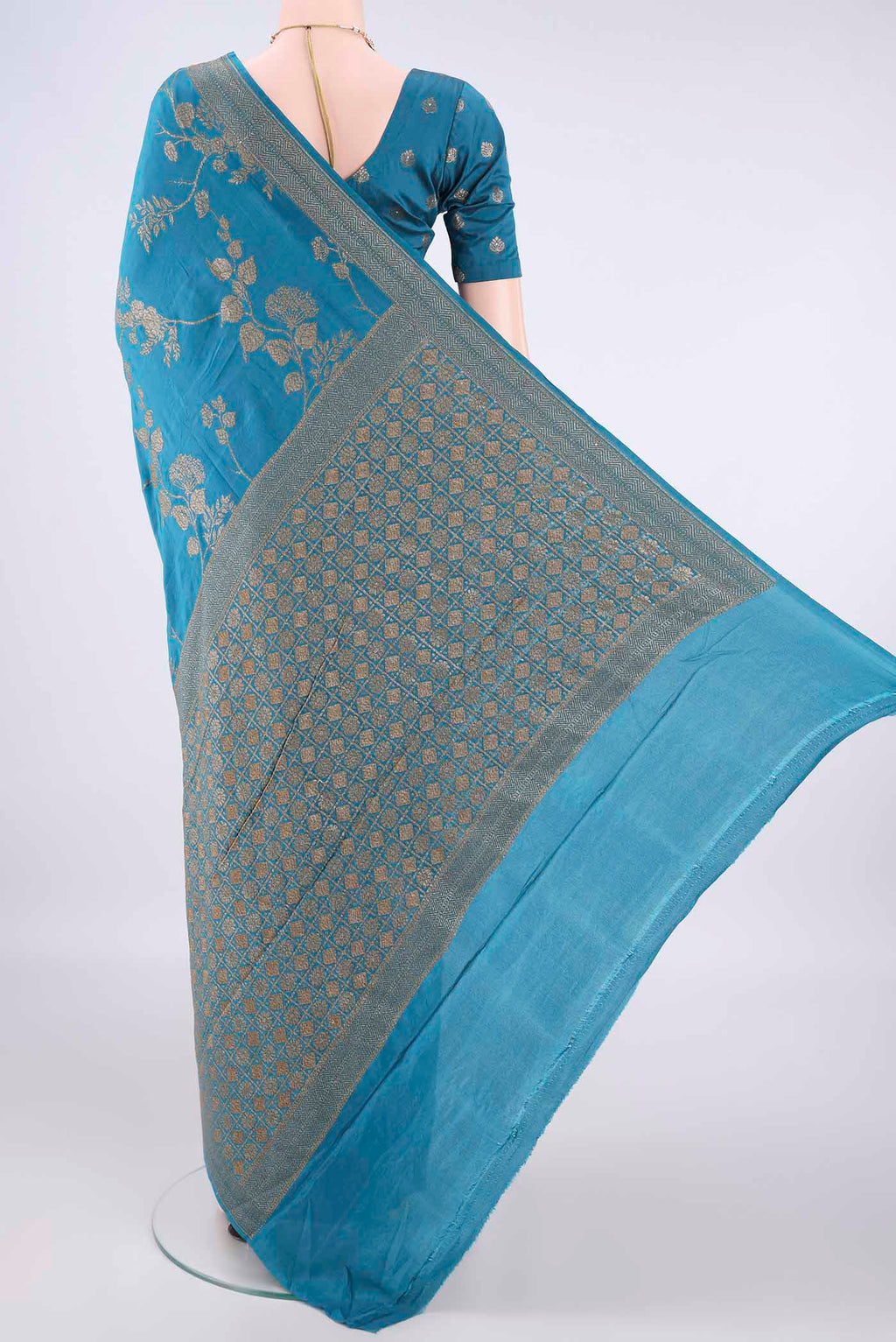 Flat view of Pure Silk Blue Banarasi Georgette Saree with Zari Brocade on the body and Zari Border. 