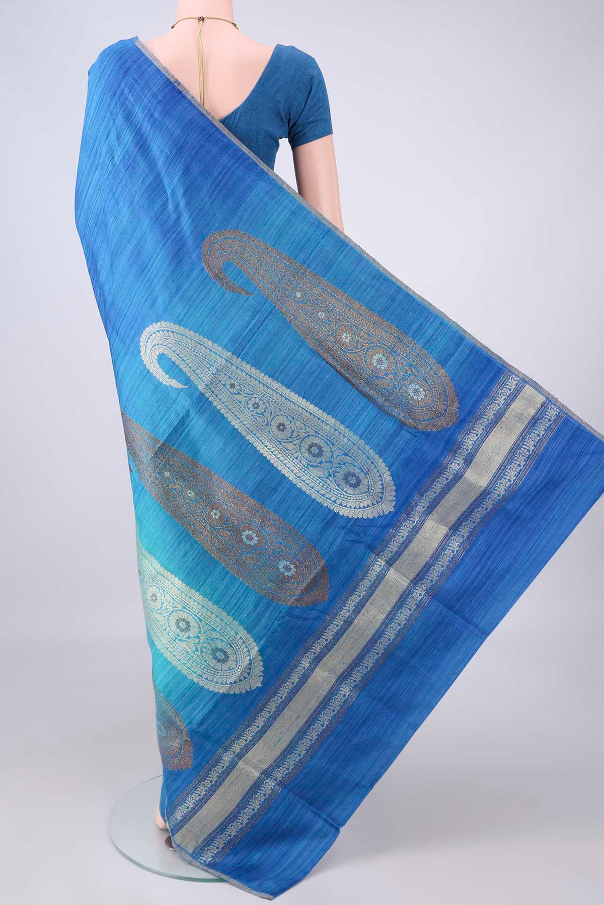 Flat view of Multi Color Banarasi Tussar Saree with Ombre design on the body and Zari Border. 