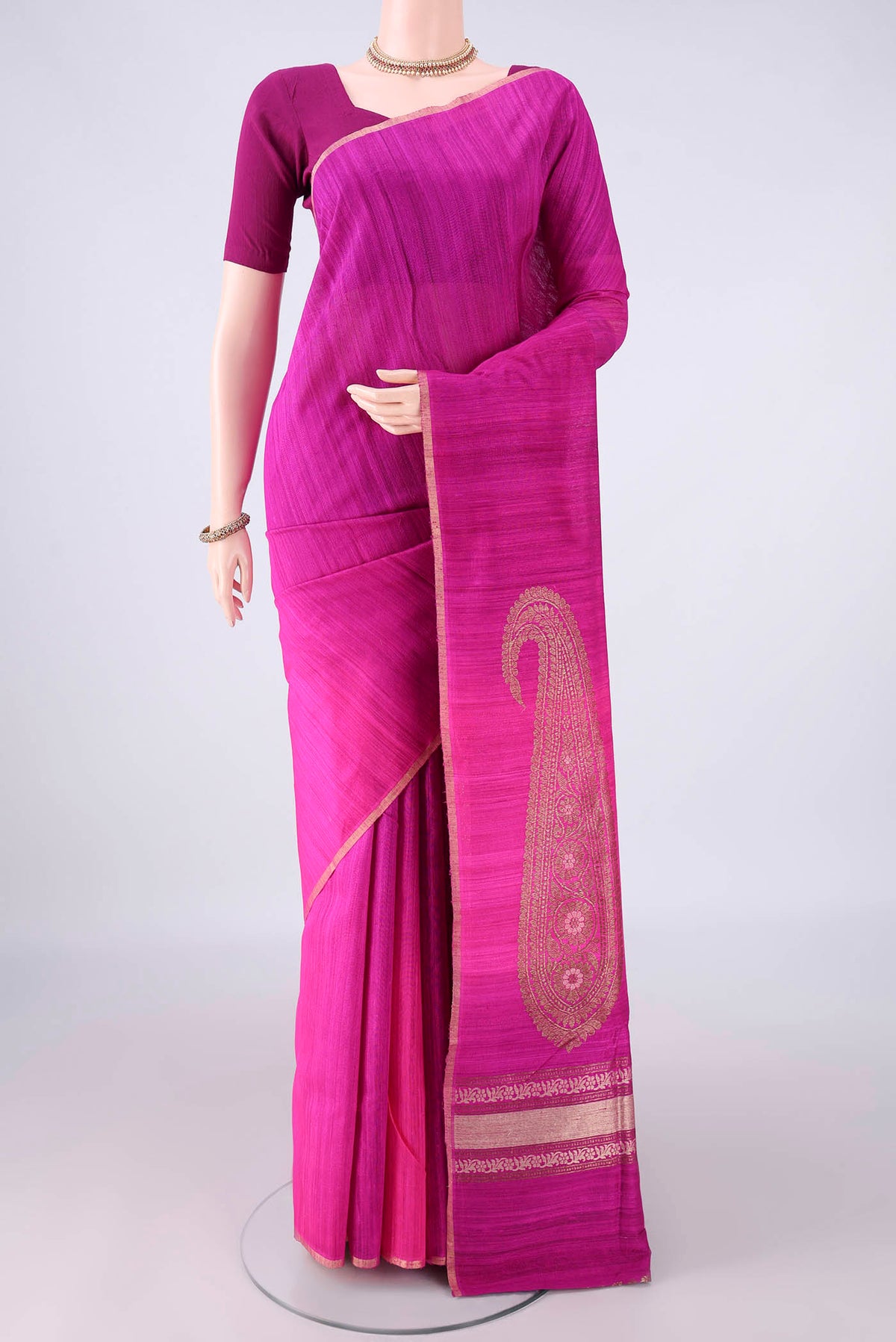 Magenta Banarasi Tussar Saree with Ombre design on the body and Zari Border.  displayed on a mannequin