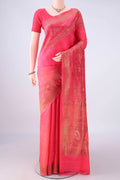 Coral Banarasi Tussar Saree with Zari Butta on the body and Zari Border.  displayed on a mannequin