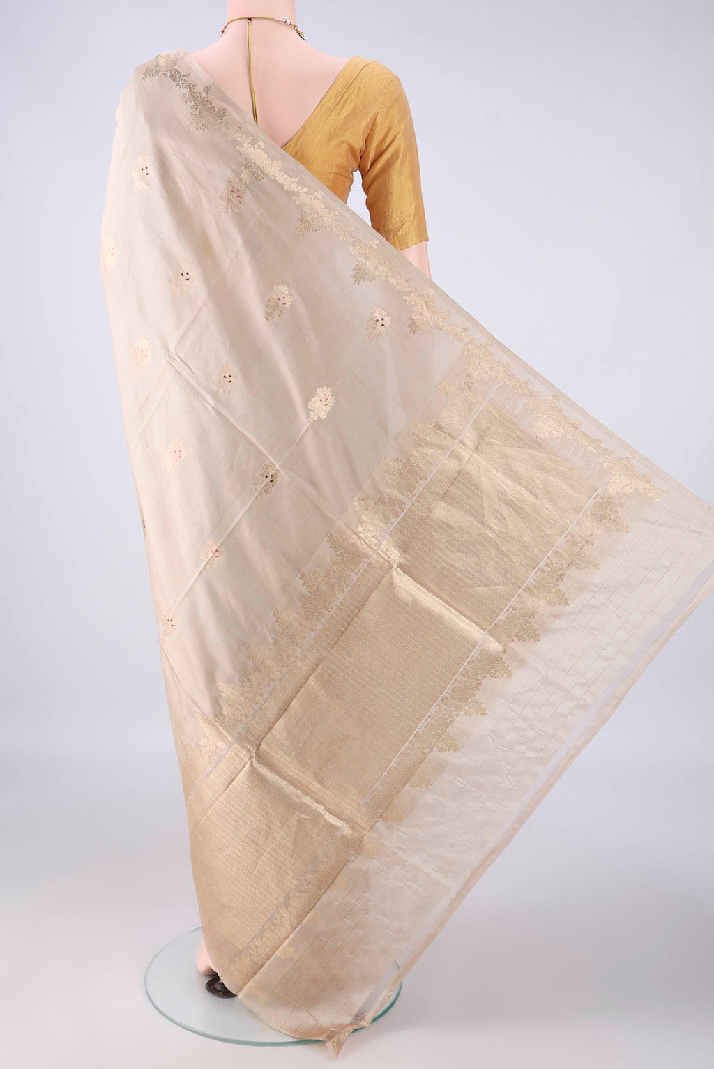 Flat view of Pure Silk Beige Banarasi Katan Saree with Zari And Thread Butta on the body and Zari Border. 