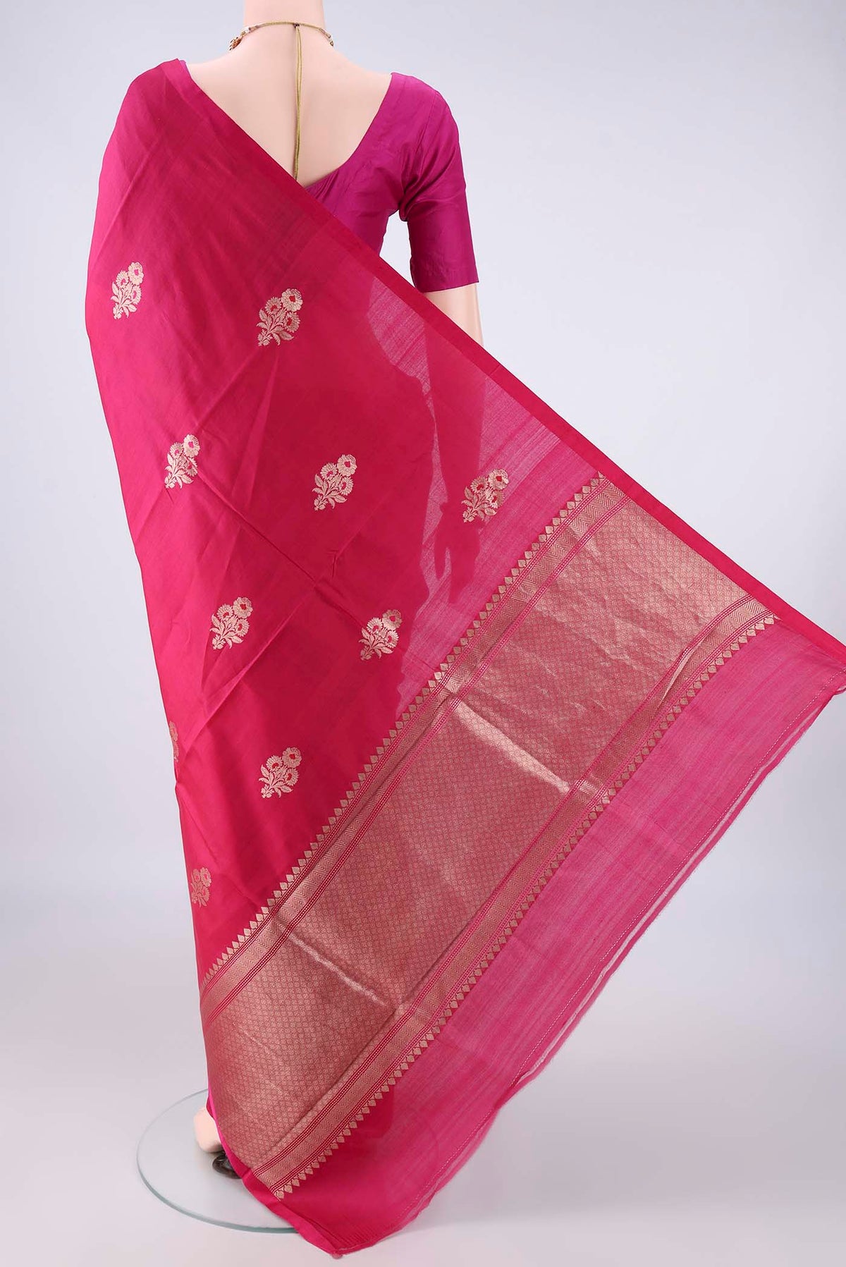 Flat view of Pure Silk Rani Pink Banarasi Katan Saree with Zari And Thread Butta on the body and Without Border. 