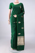 Pure Silk Bottle Green Banarasi Katan Saree with Zari And Thread Butta on the body and Without Border.  displayed on a mannequin