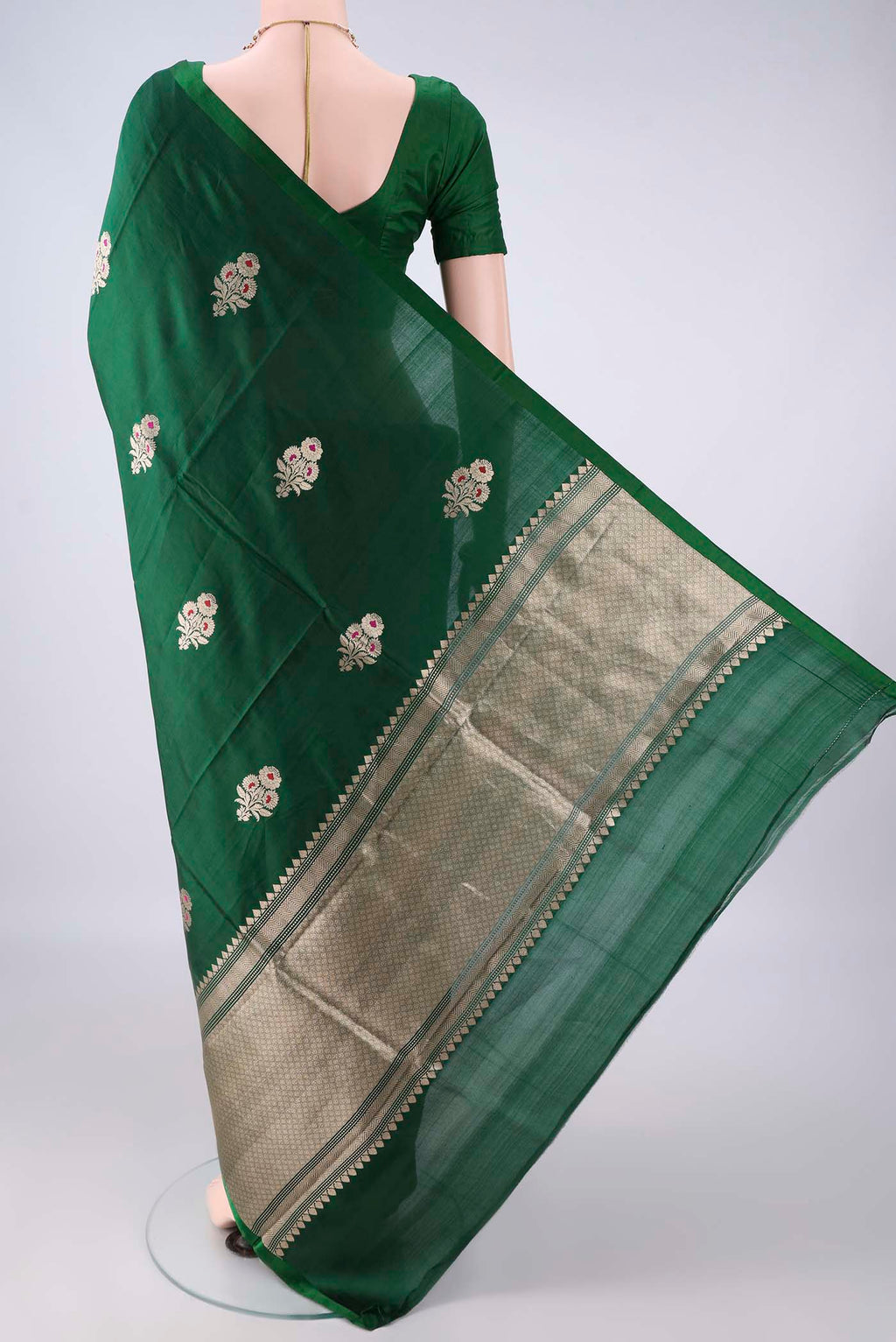 Flat view of Pure Silk Bottle Green Banarasi Katan Saree with Zari And Thread Butta on the body and Without Border. 