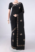 Pure Silk Black Banarasi Katan Saree with Zari Butta on the body and Zari Border.  displayed on a mannequin