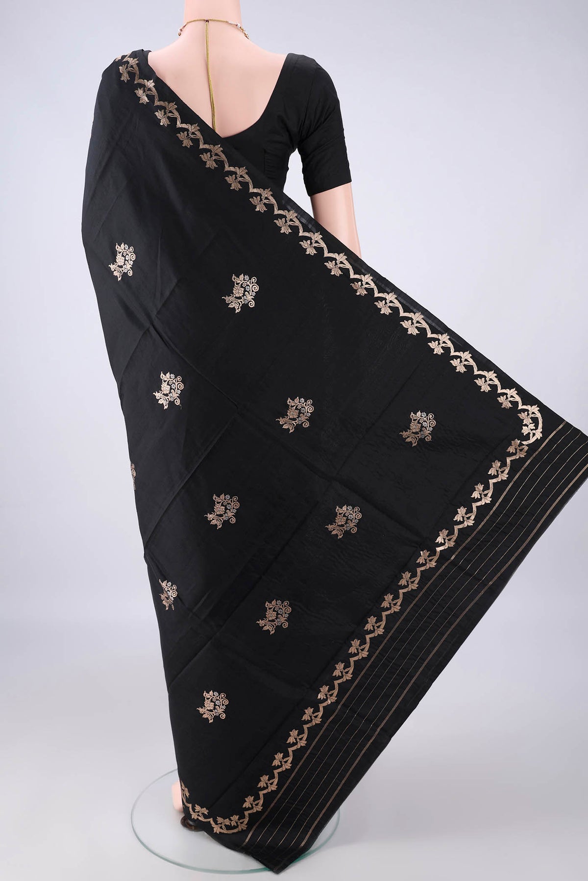Flat view of Pure Silk Black Banarasi Katan Saree with Zari Butta on the body and Zari Border. 