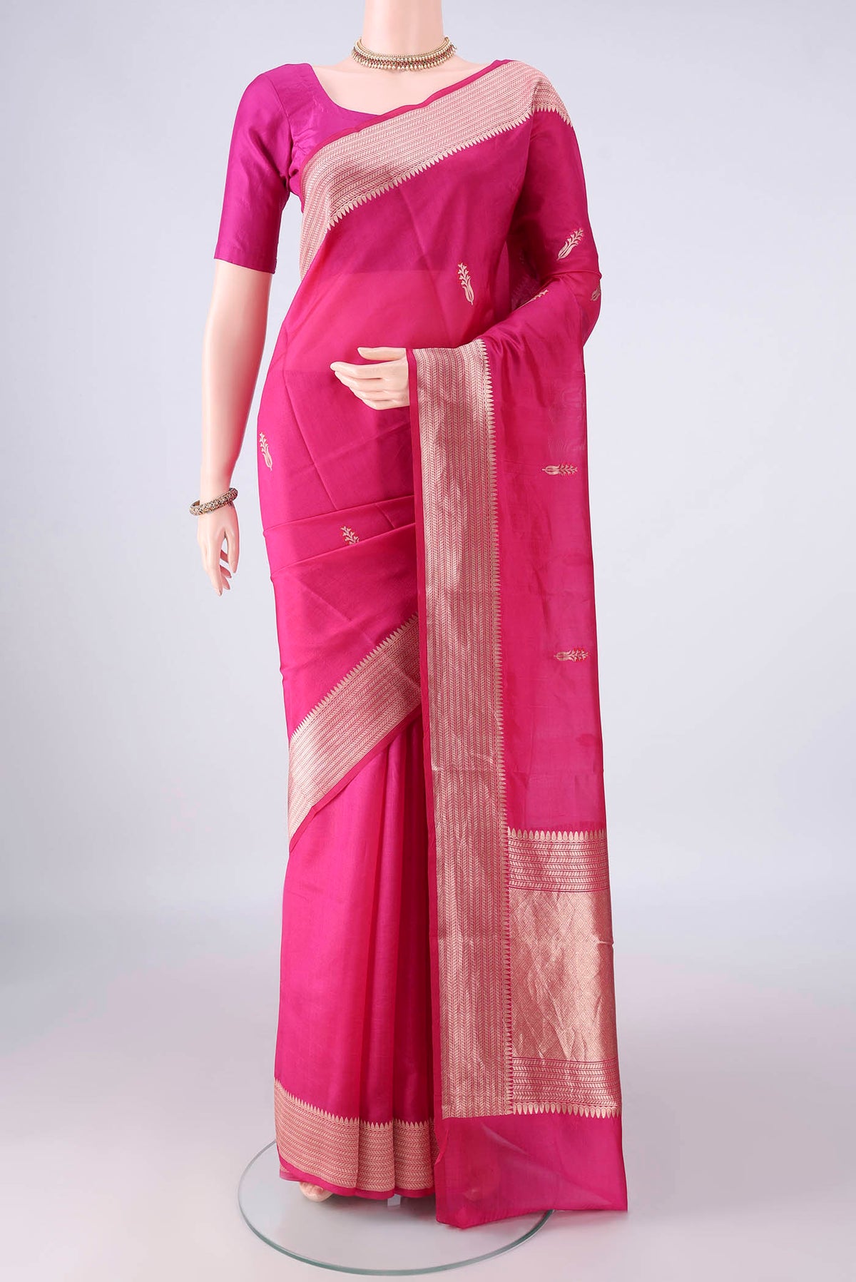 Pure Silk Pink Banarasi Katan Saree with Zari And Thread Butta on the body and Zari Border.  displayed on a mannequin