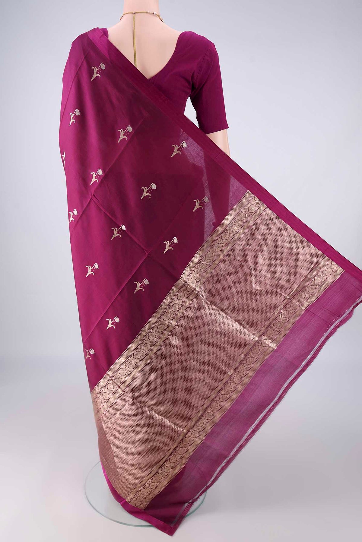 Flat view of Pure Silk Burgundy Banarasi Katan Saree with Zari And Thread Butta on the body and Without Border. 