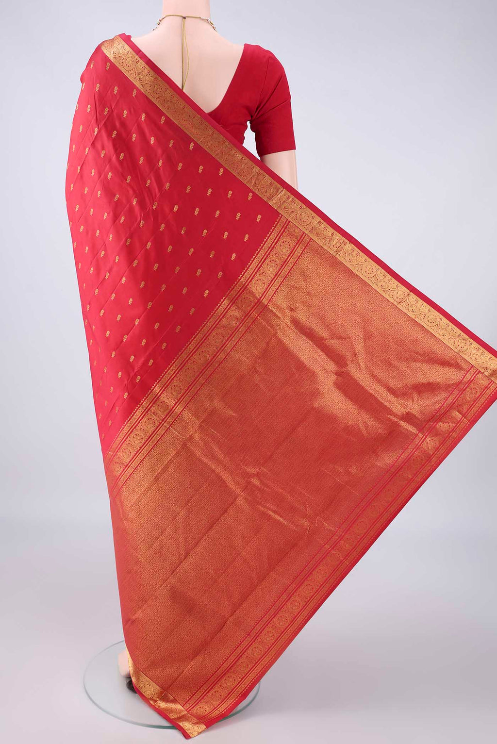 Flat view of Pure Silk Red Kanjivaram Saree with Zari Butta on the body and Zari Border. 
