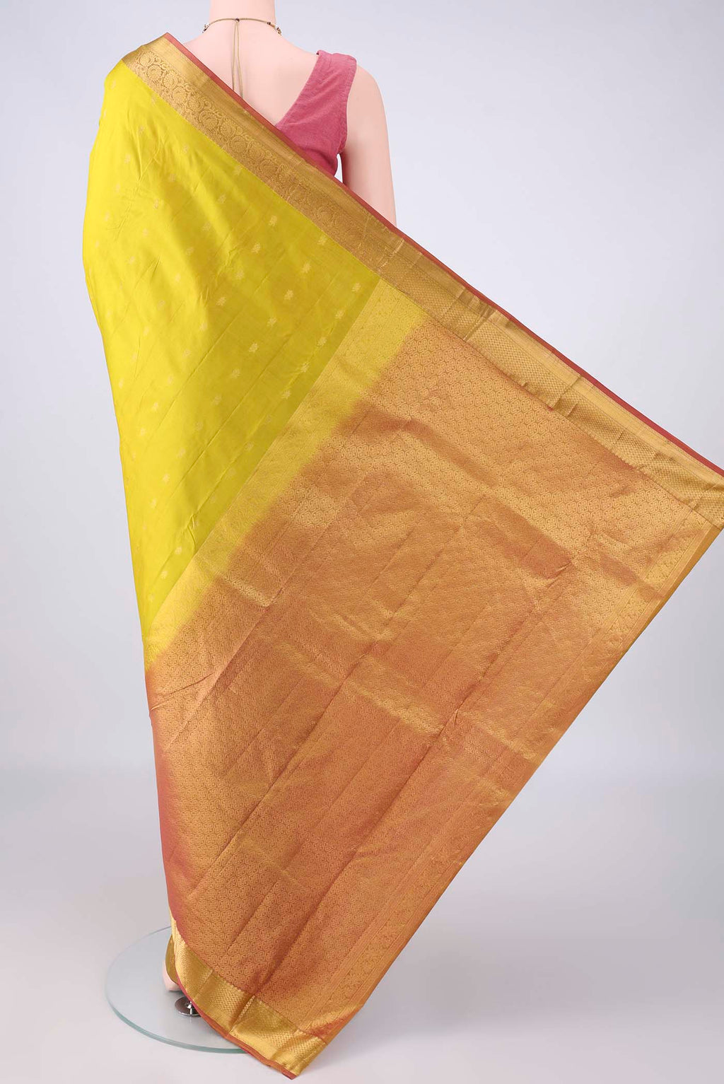 Flat view of Pure Silk Yellow Kanjivaram Saree with Zari Butta on the body and Zari Border. 
