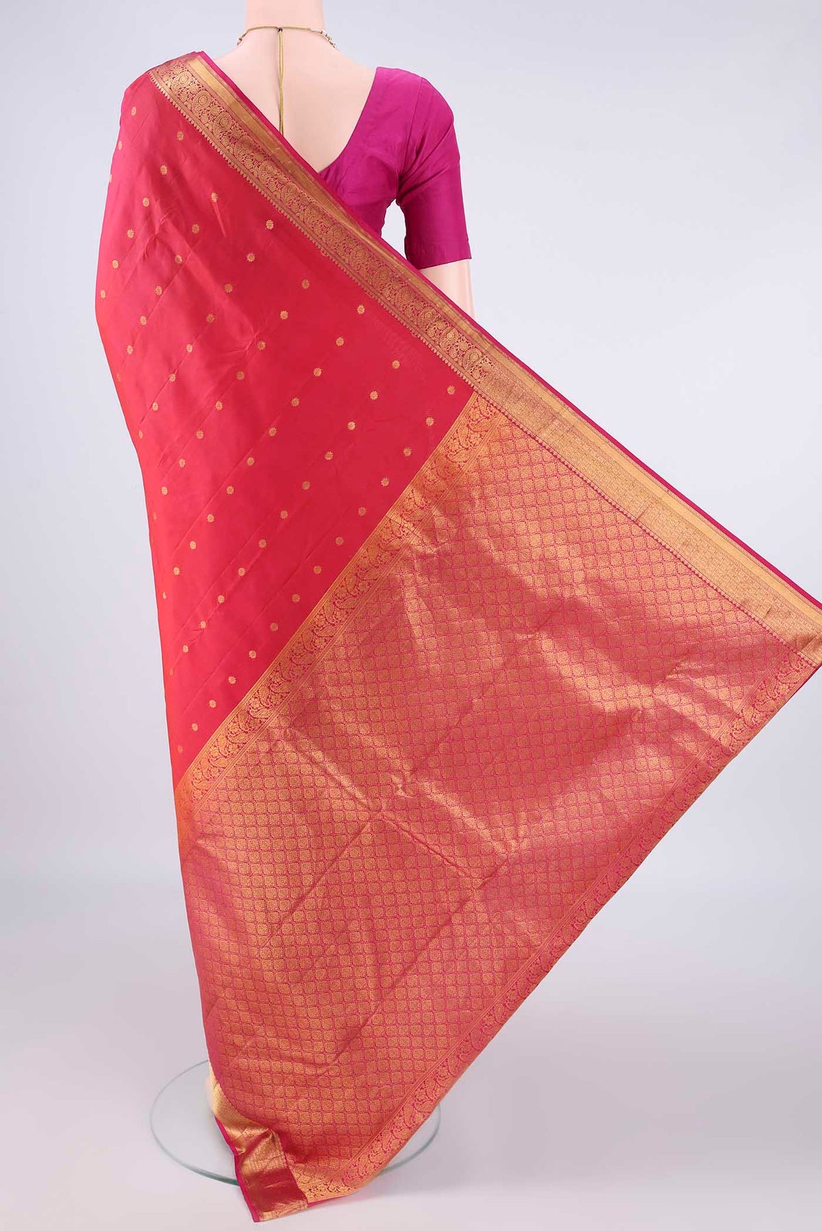 Flat view of Pure Silk Imperial Red Kanjivaram Saree with Zari Butta on the body and Zari Border. 