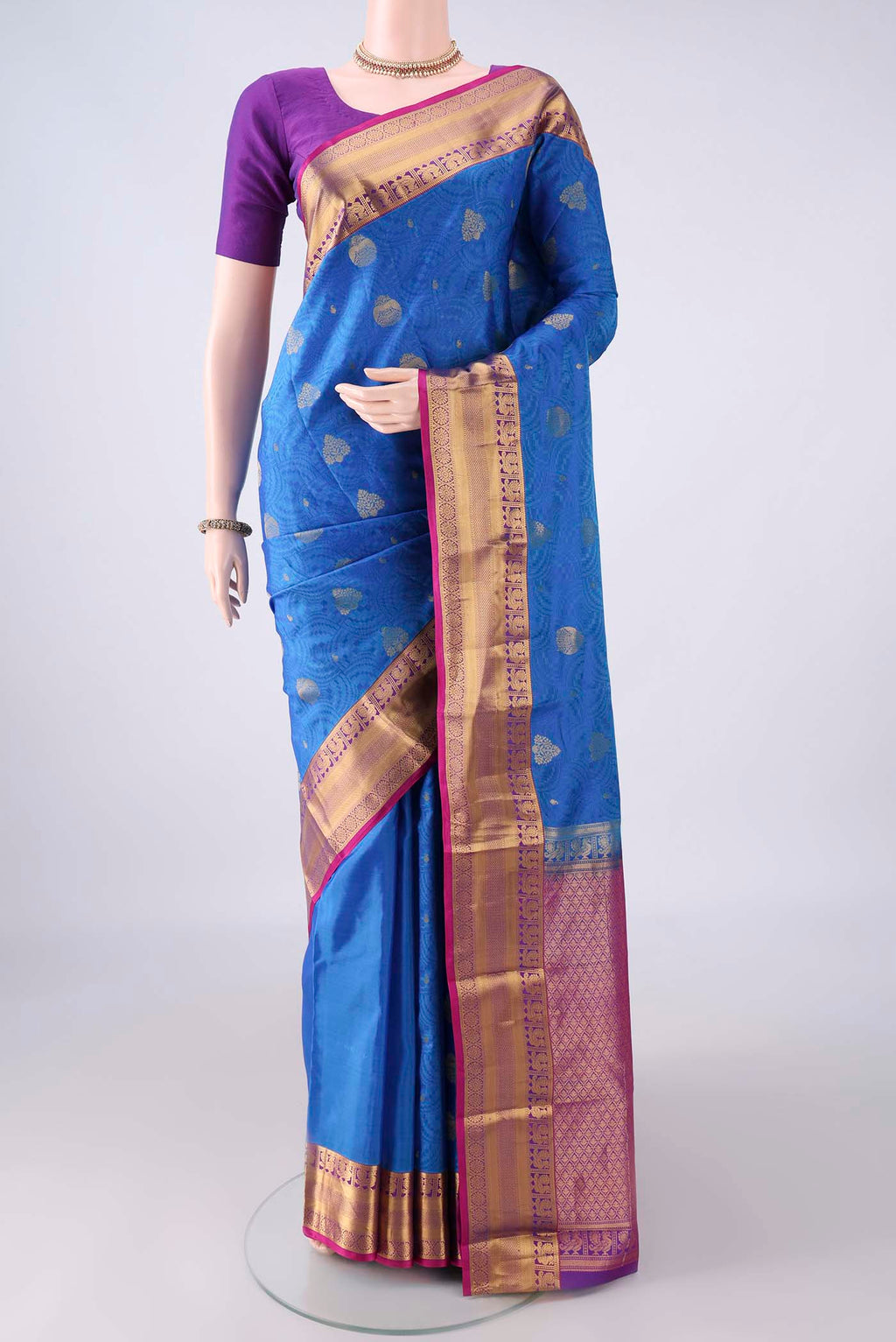 Pure Silk Blue Kanchipuram Saree with Jacquard With Zari Butta on the body and Zari Border.  displayed on a mannequin