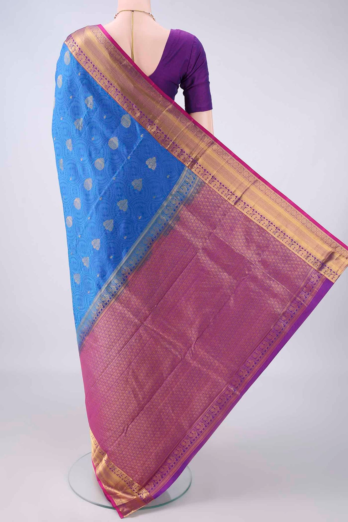 Flat view of Pure Silk Blue Kanchipuram Saree with Jacquard With Zari Butta on the body and Zari Border. 