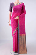 Pure Silk Rani Pink Kanjivaram Saree with Zari Butta on the body and Zari Border.  displayed on a mannequin