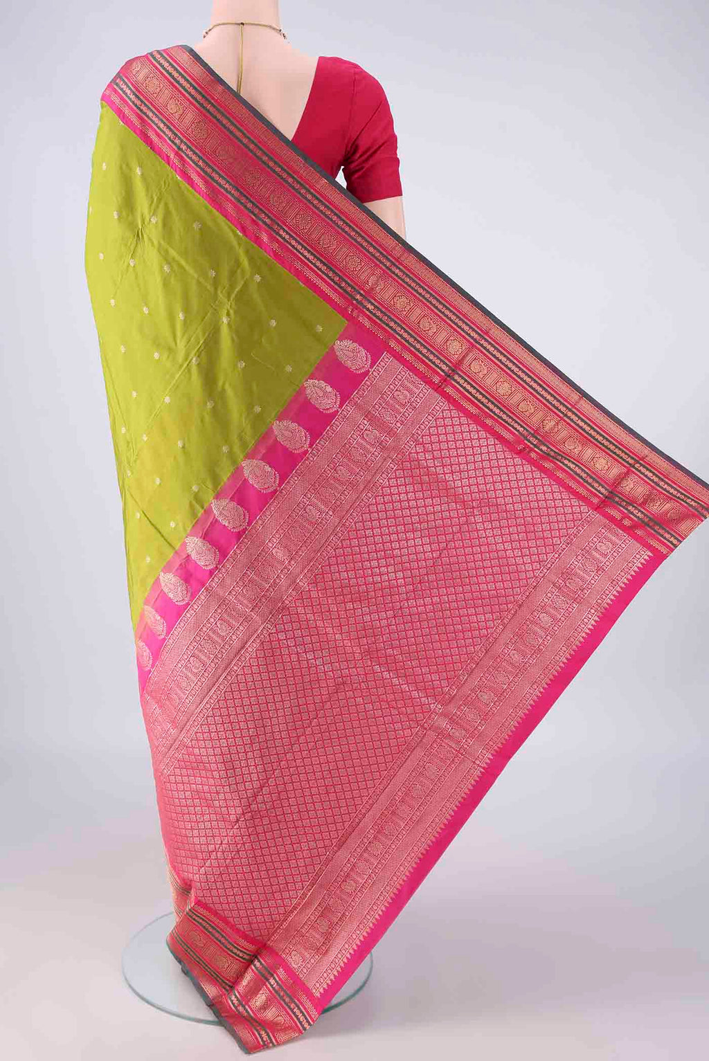 Flat view of Green Blended Bangalore Silk Saree with Zari Butta on the body and Zari Border. 