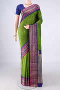 Green Blended Bangalore Silk Saree with Zari Butta on the body and Zari Border.  displayed on a mannequin