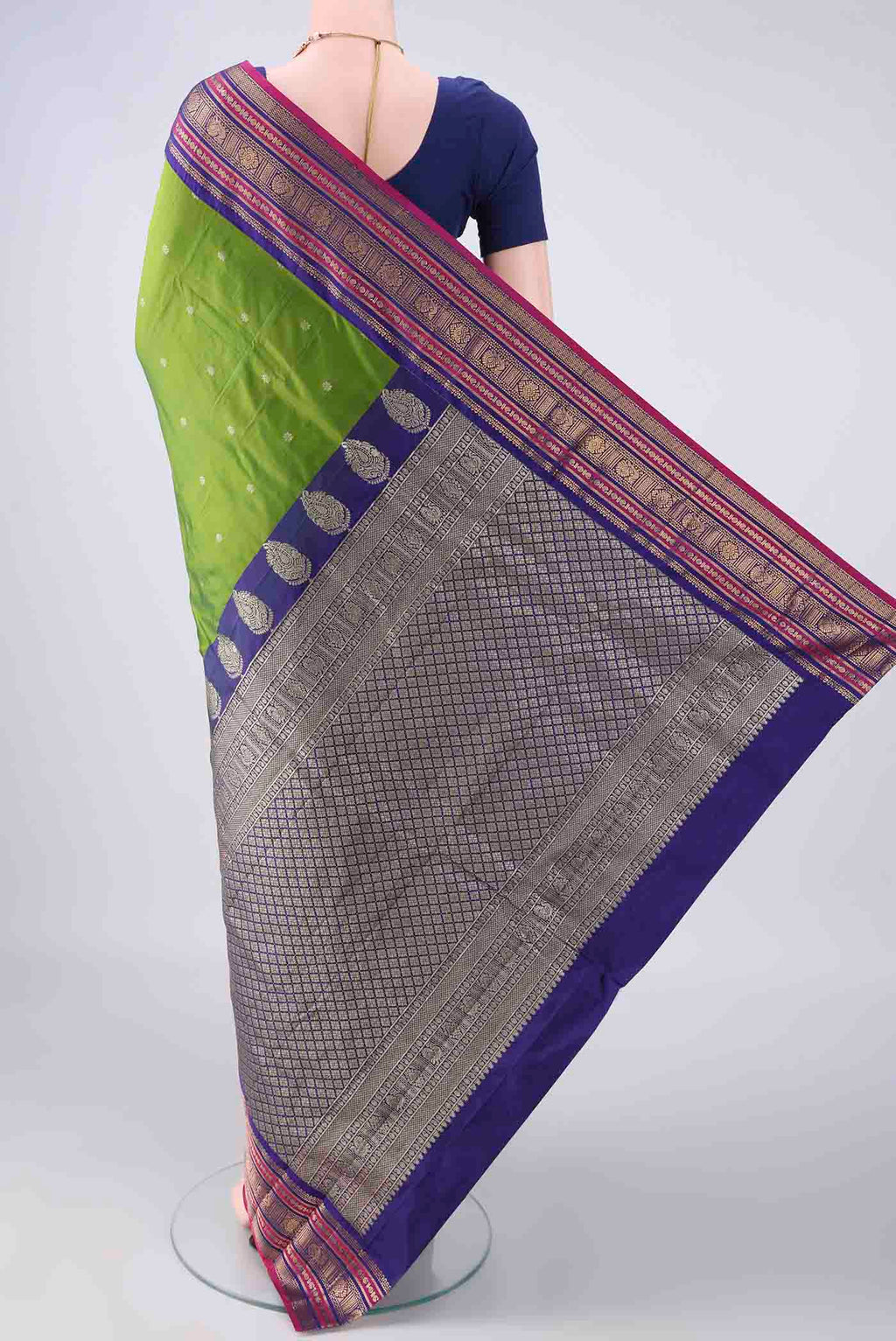 Flat view of Green Blended Bangalore Silk Saree with Zari Butta on the body and Zari Border. 