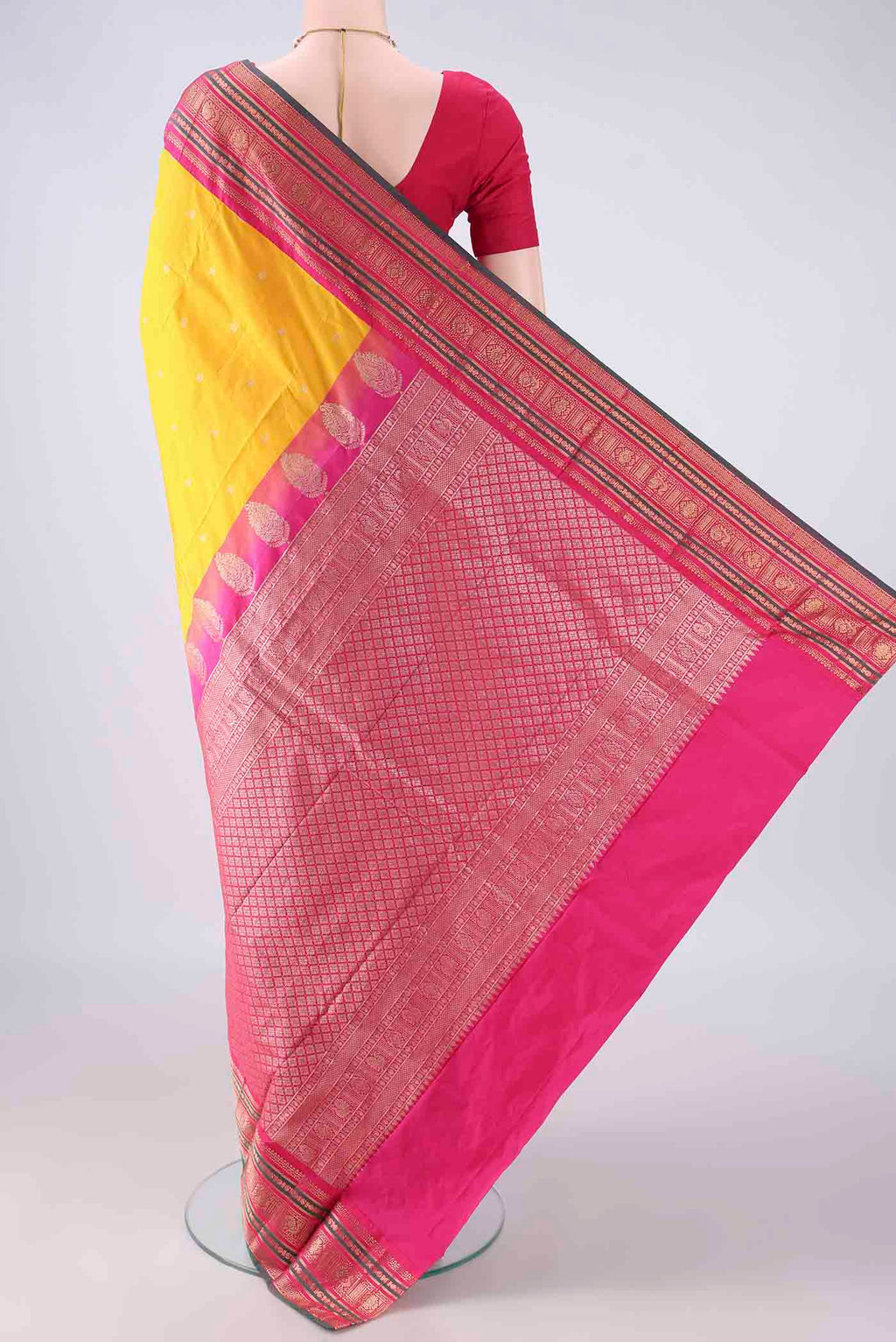 Flat view of Yellow Blended Bangalore Silk Saree with Zari Butta on the body and Zari Border. 
