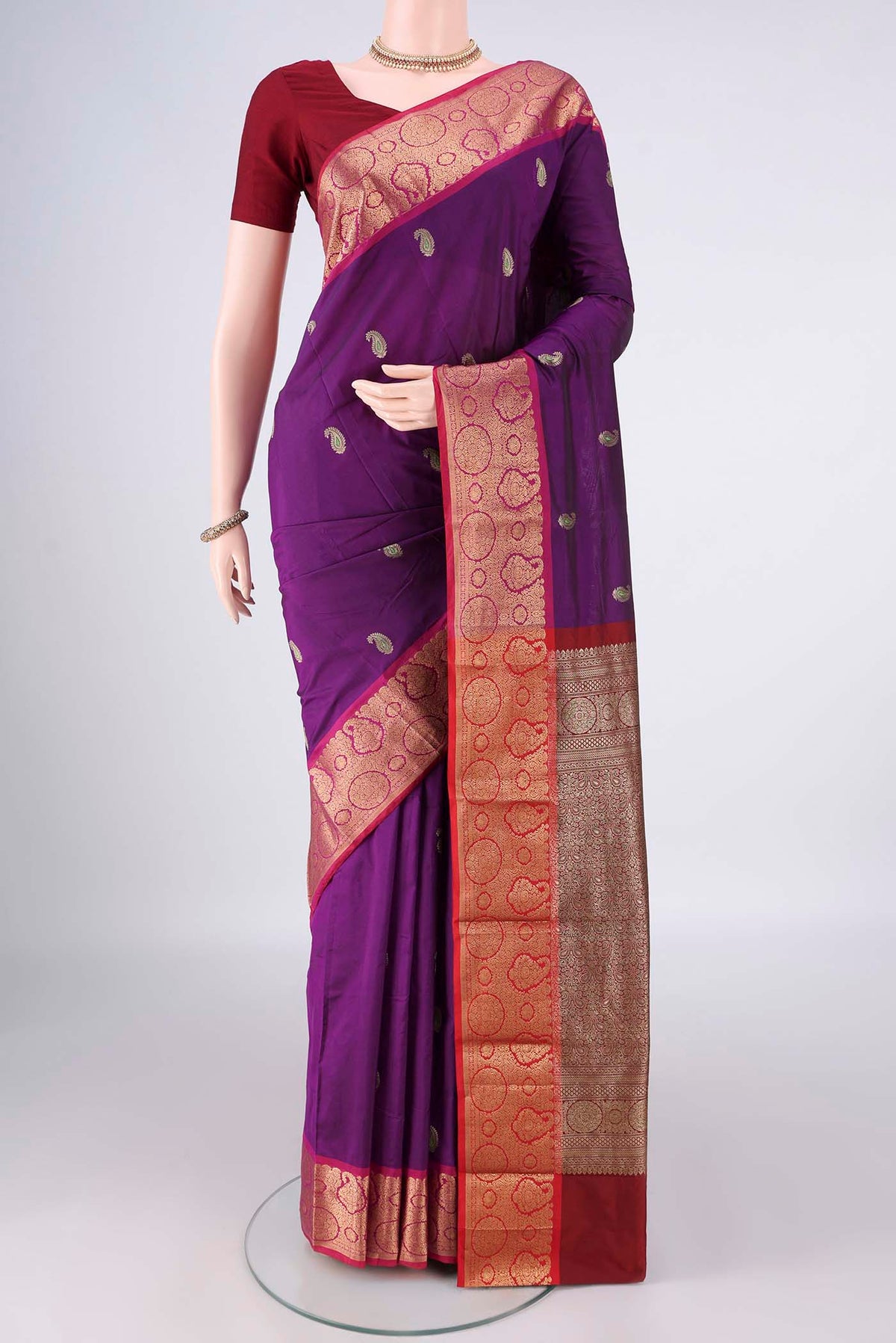 Purple Blended Bangalore Silk Saree with Zari Butta on the body and Zari Border.  displayed on a mannequin