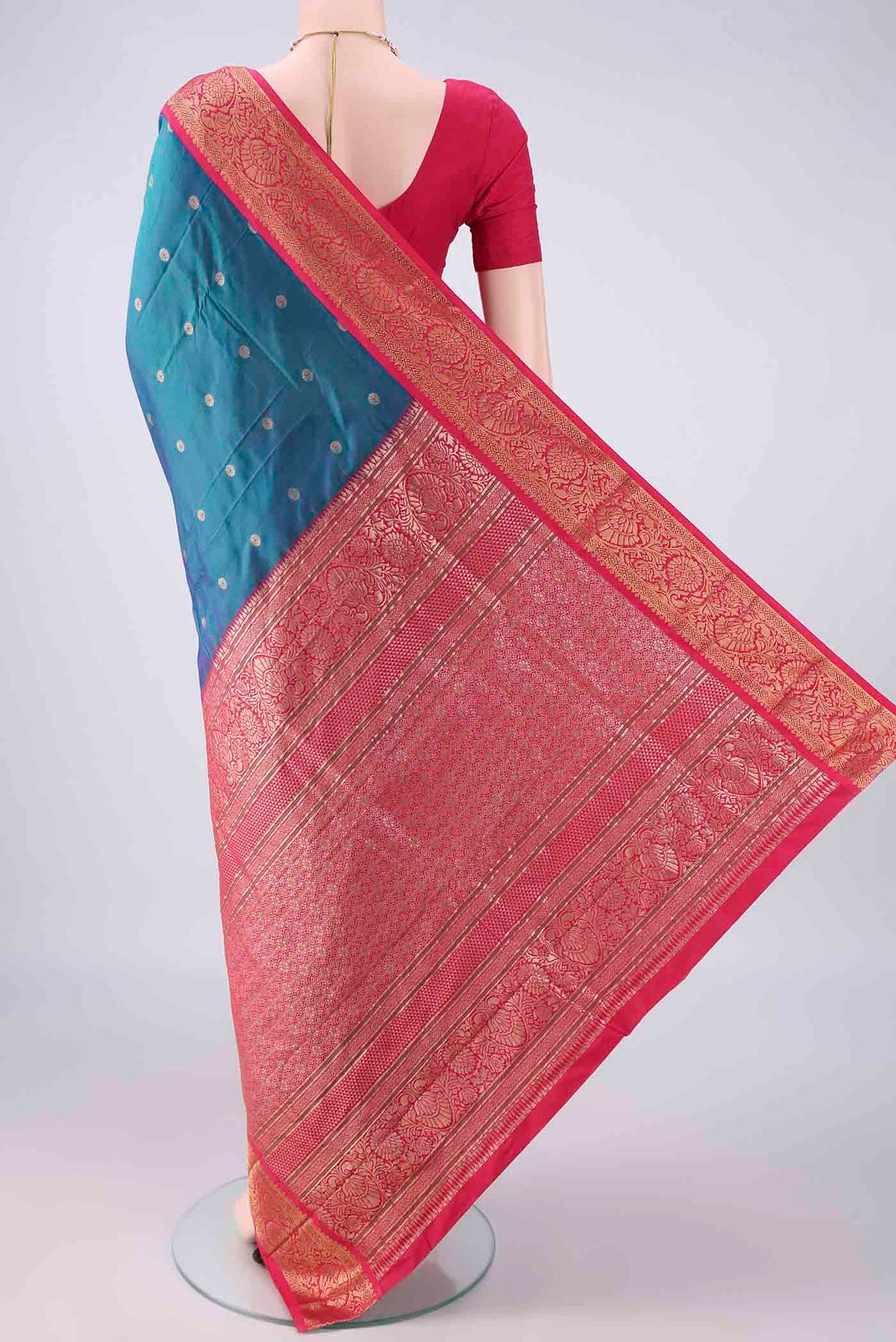 Flat view of Peacock Blue Blended Bangalore Silk Saree with Zari Butta on the body and Zari Border. 