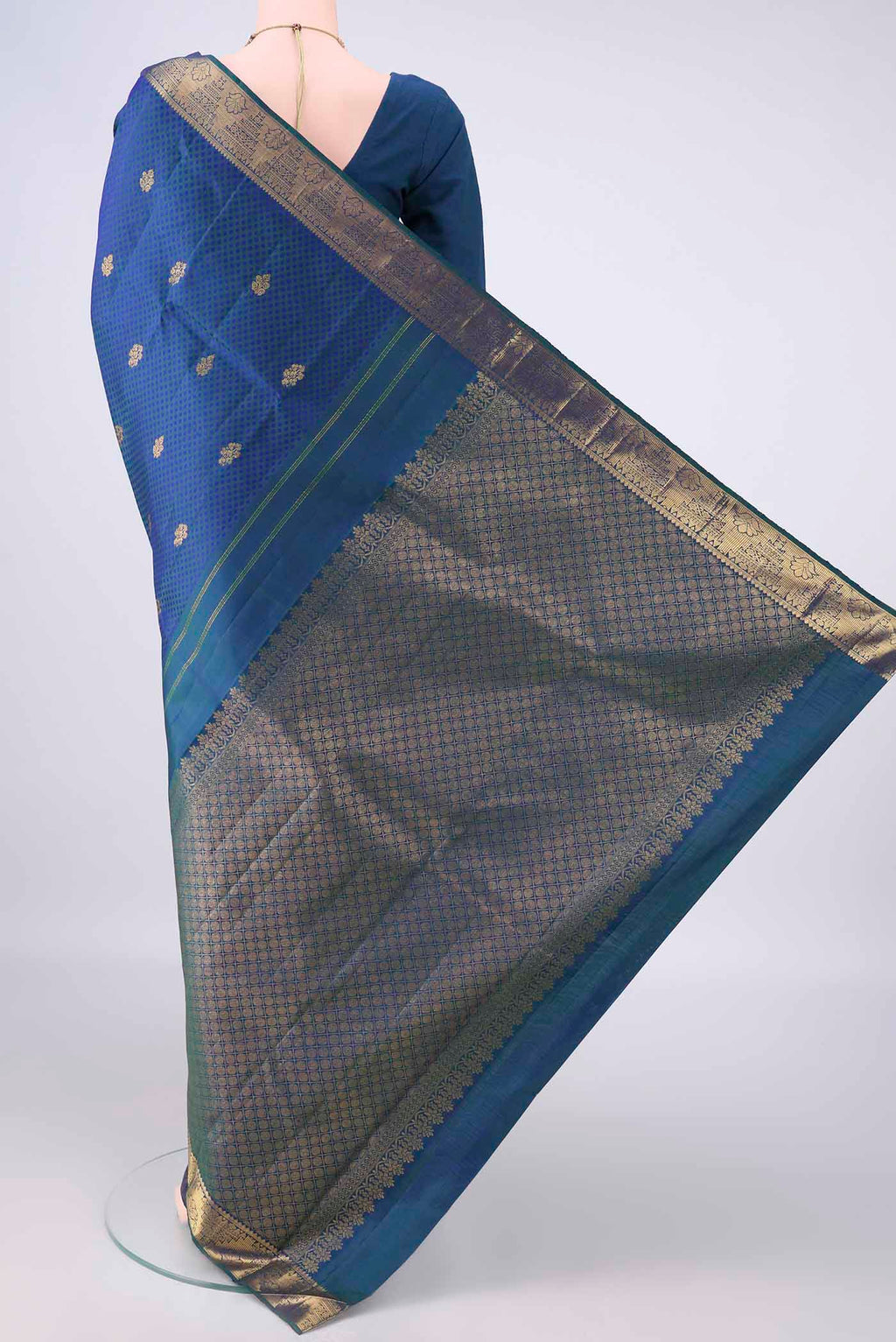Flat view of Pure Silk Peacock Blue Kanjivaram Saree with Jacquard With Zari Butta on the body and Zari Border. 