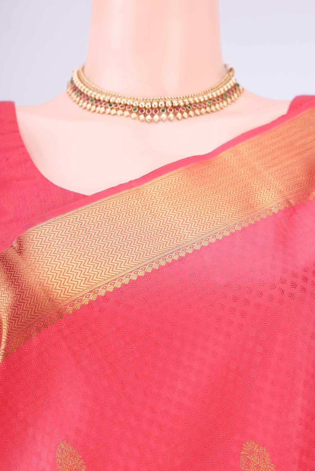 Border image of Pure Silk Coral Kanjivaram Saree with Jacquard With Zari Butta on the body and Zari Border. 