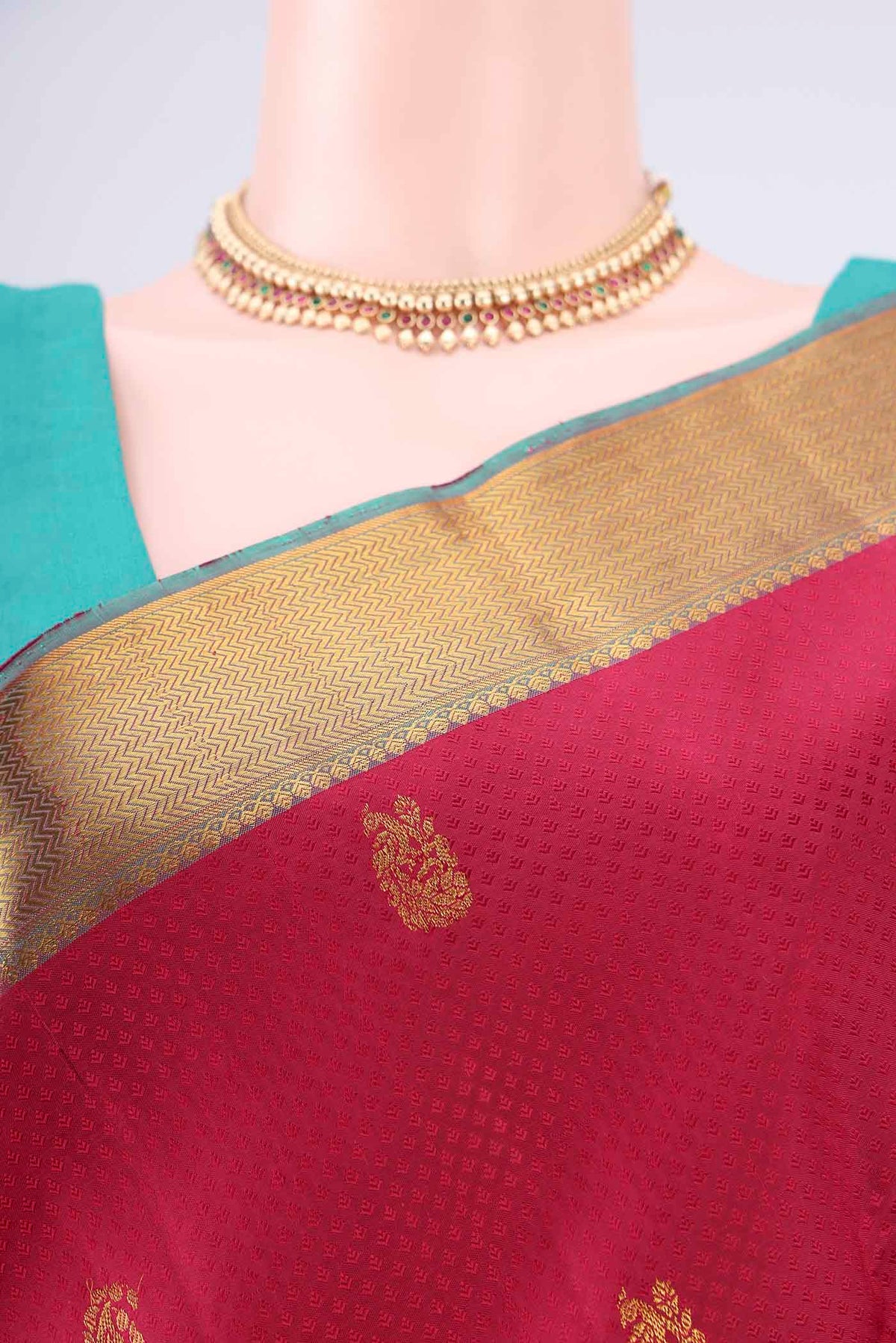 Border image of Pure Silk Deep Red Kanjivaram Saree with Jacquard With Zari Butta on the body and Zari Border. 
