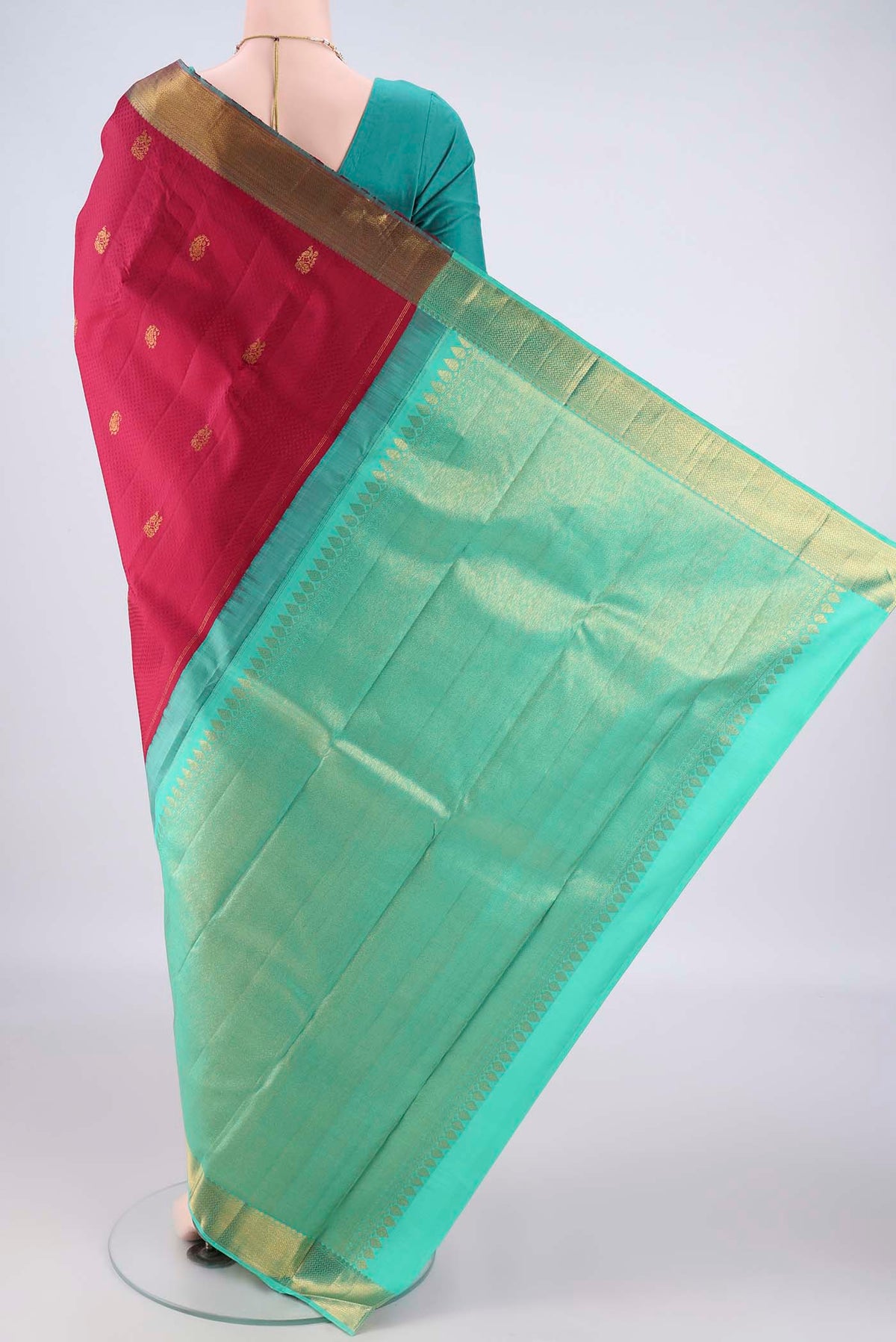 Flat view of Pure Silk Deep Red Kanjivaram Saree with Jacquard With Zari Butta on the body and Zari Border. 