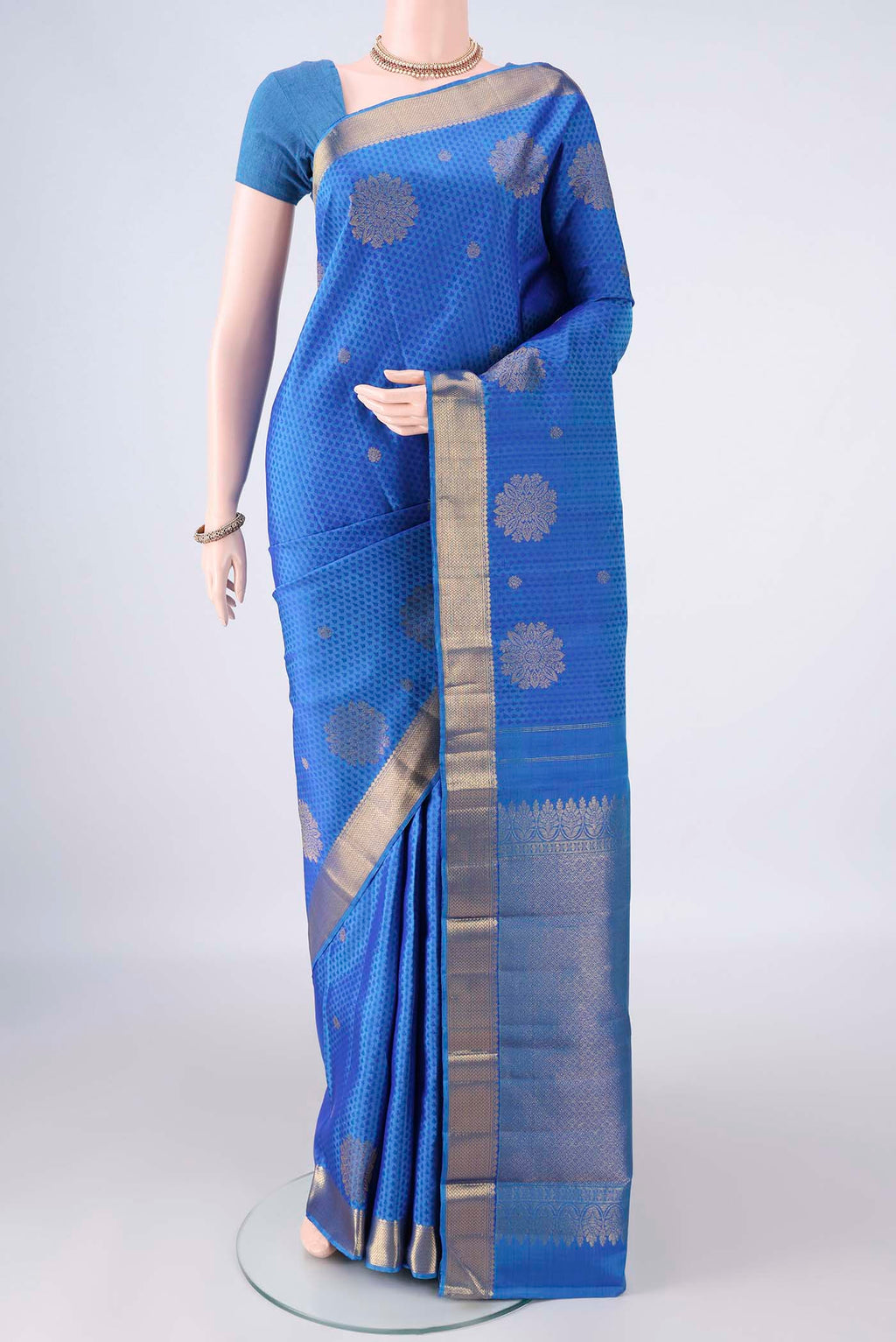 Pure Silk Royal Blue Kanjivaram Saree with Jacquard With Zari Butta on the body and Zari Border.  displayed on a mannequin