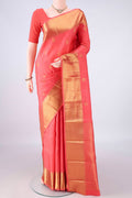 Pure Silk Peach Kanjivaram Saree with Jacquard With Zari Butta on the body and Zari Border.  displayed on a mannequin