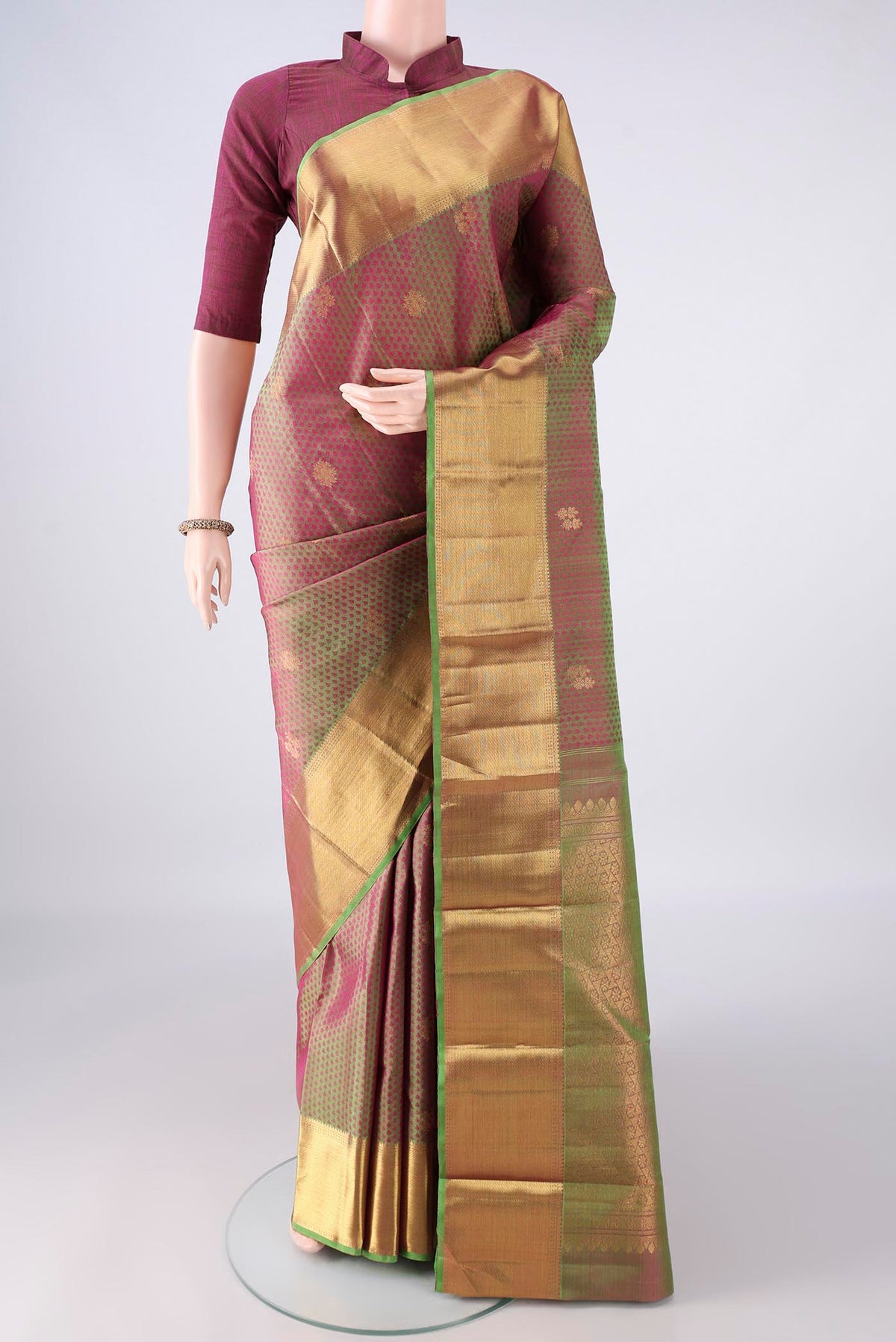 Pure Silk Green with Pink Color Kanjivaram Saree with Jacquard With Zari Butta on the body and Zari Border.  displayed on a mannequin