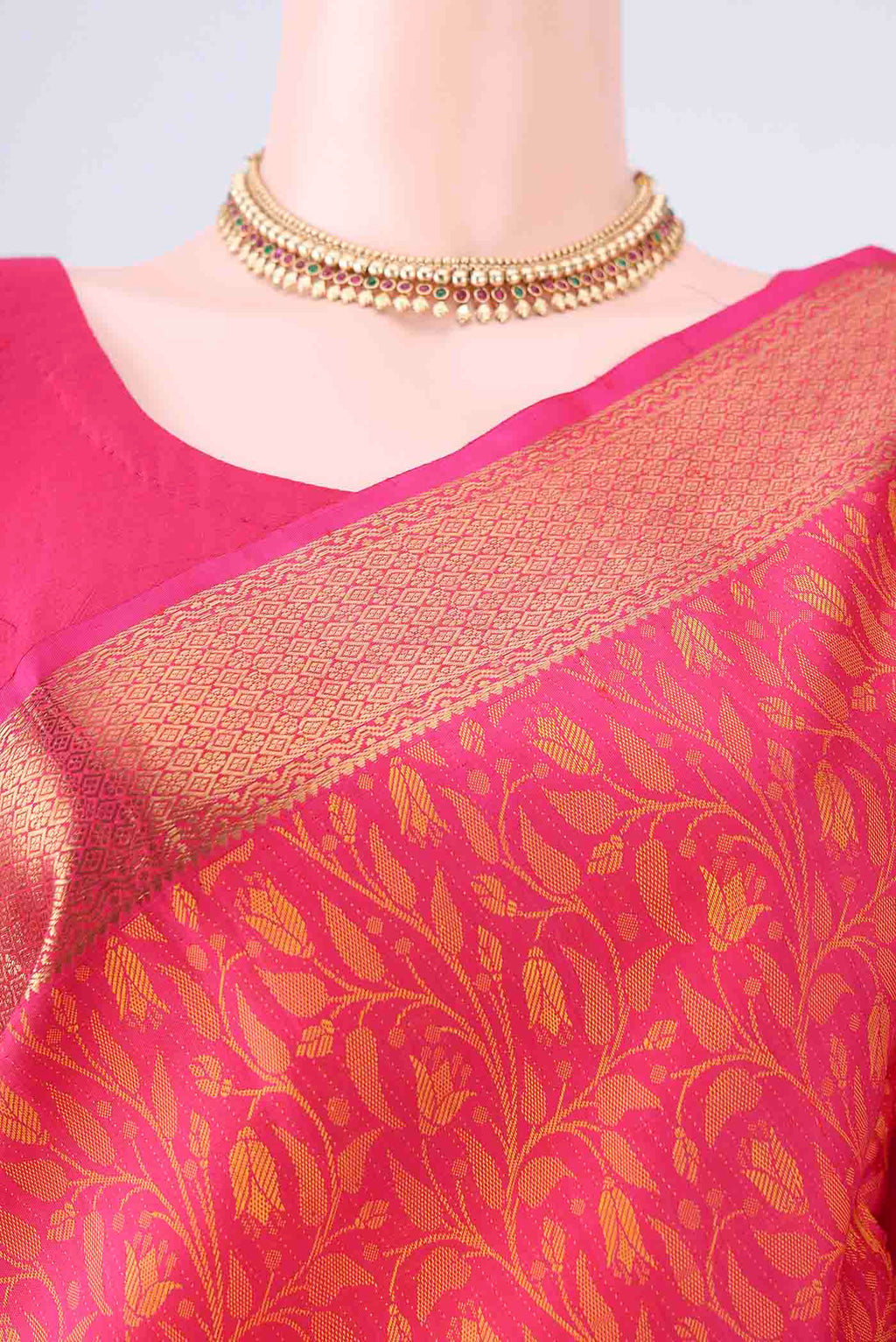 Border image of Pure Silk Rani Pink Kanjivaram Saree with Jacquard design on the body and Zari Border. 