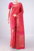 Pure Silk Rani Pink Kanjivaram Saree with Jacquard design on the body and Zari Border.  displayed on a mannequin