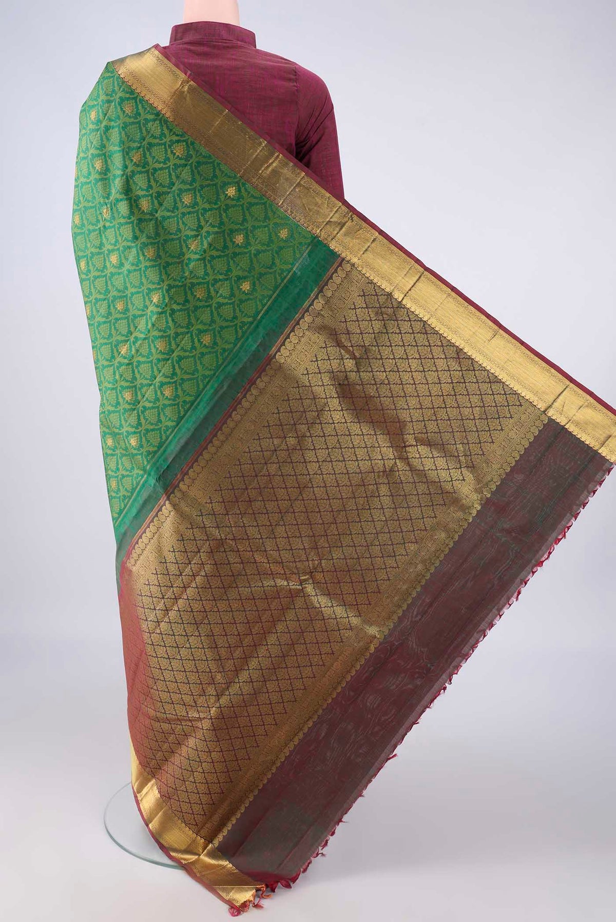 Flat view of Pure Silk Green Kanjivaram Saree with Jacquard With Zari Butta on the body and Zari Border. 