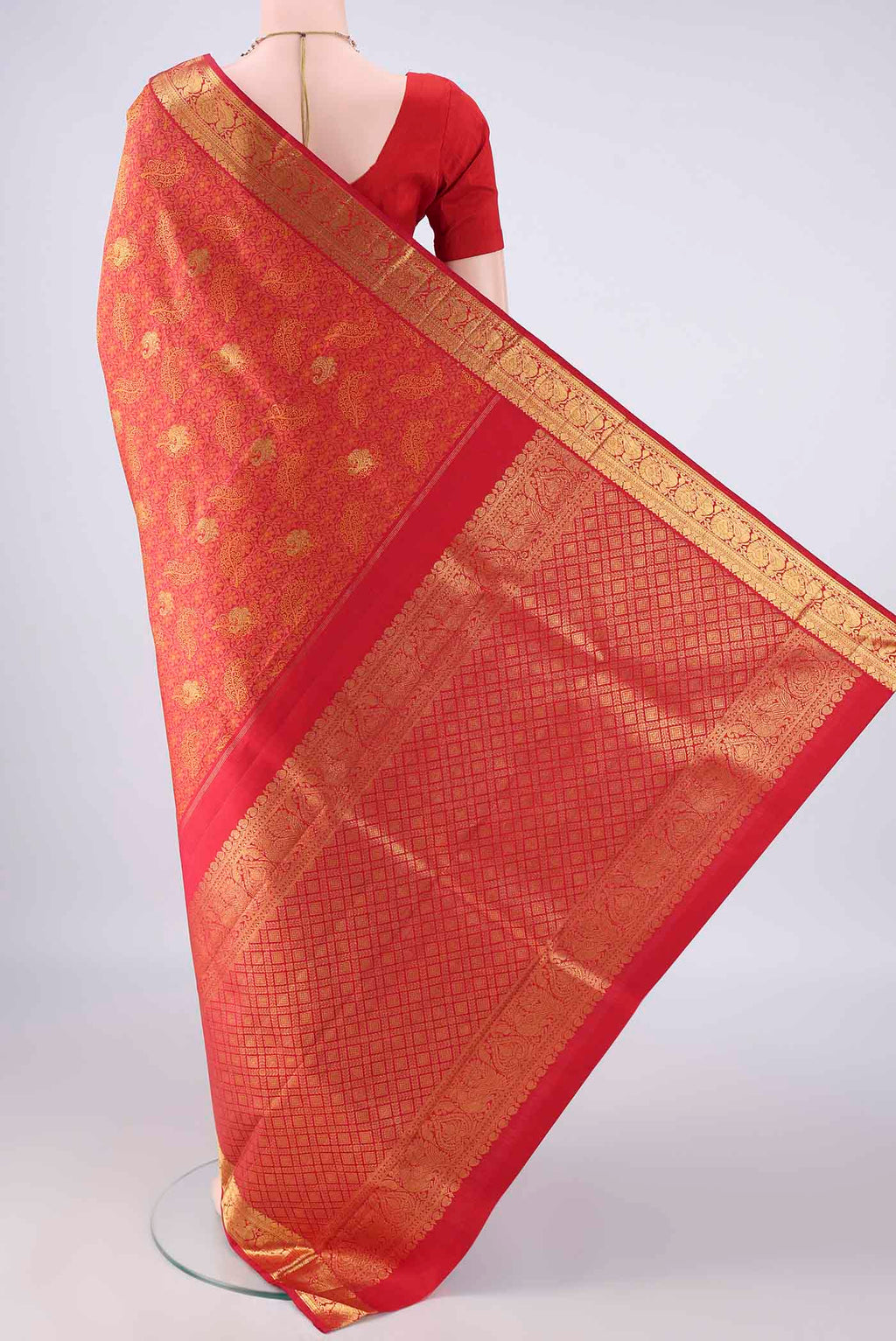 Flat view of Pure Silk Red Kanjivaram Saree with Jacquard With Zari Butta on the body and Zari Border. 