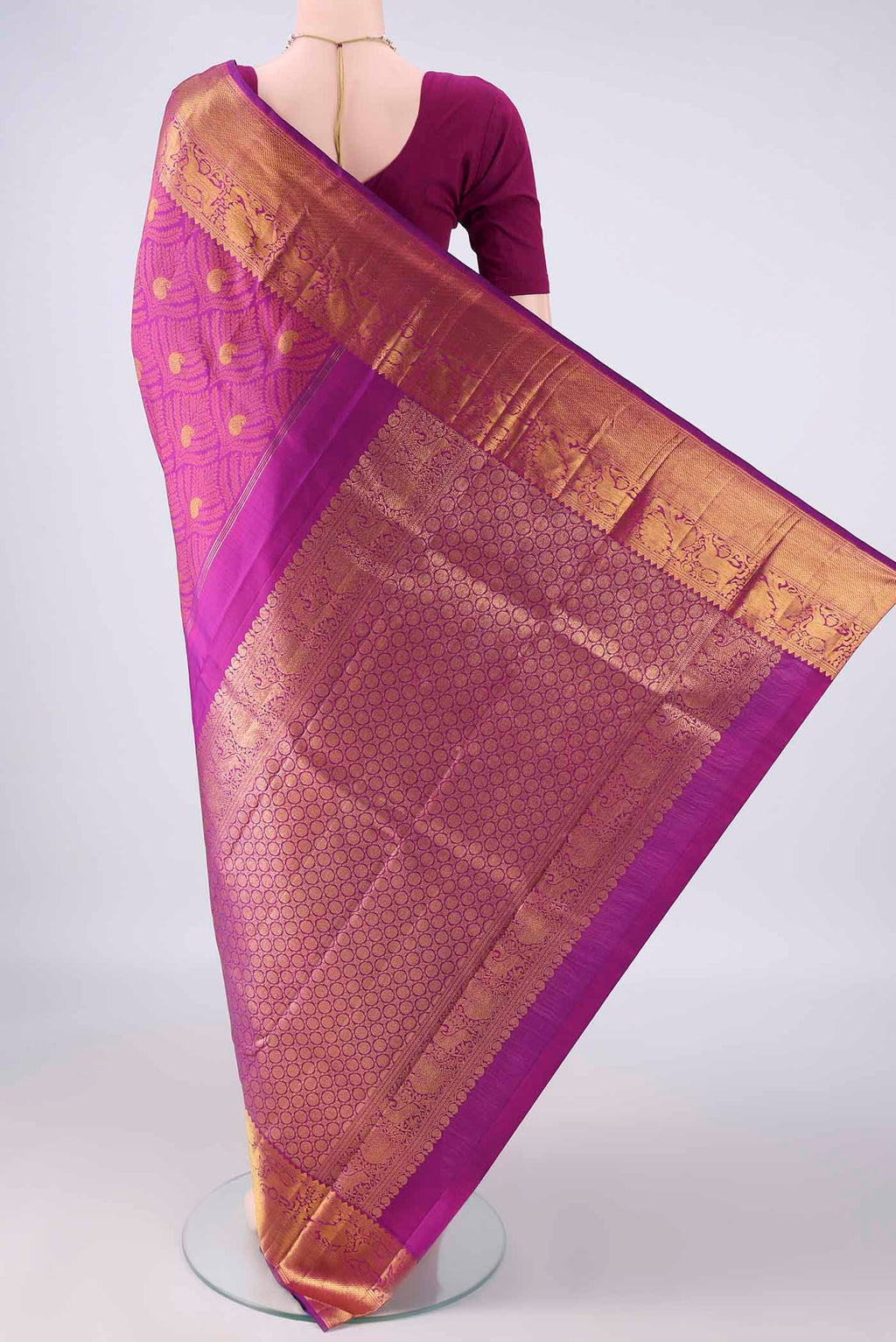 Flat view of Pure Silk Magenta Kanjivaram Saree with Jacquard With Zari Butta on the body and Zari Border. 