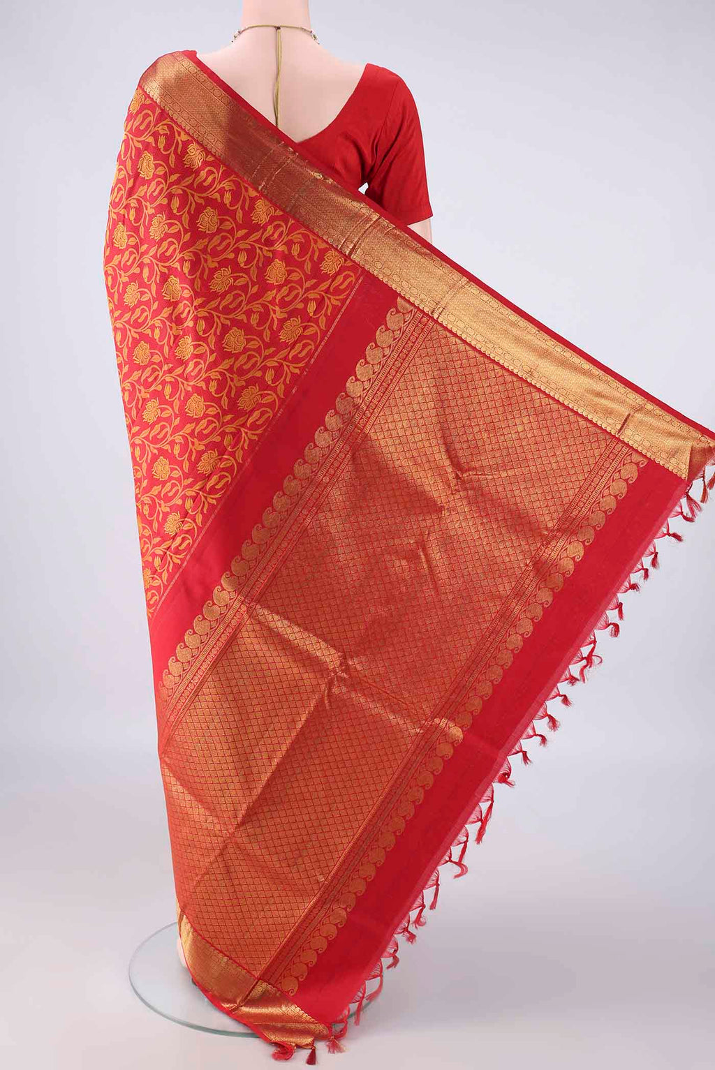 Flat view of Pure Silk Red Kanjivaram Saree with Jacquard design on the body and Zari Border. 
