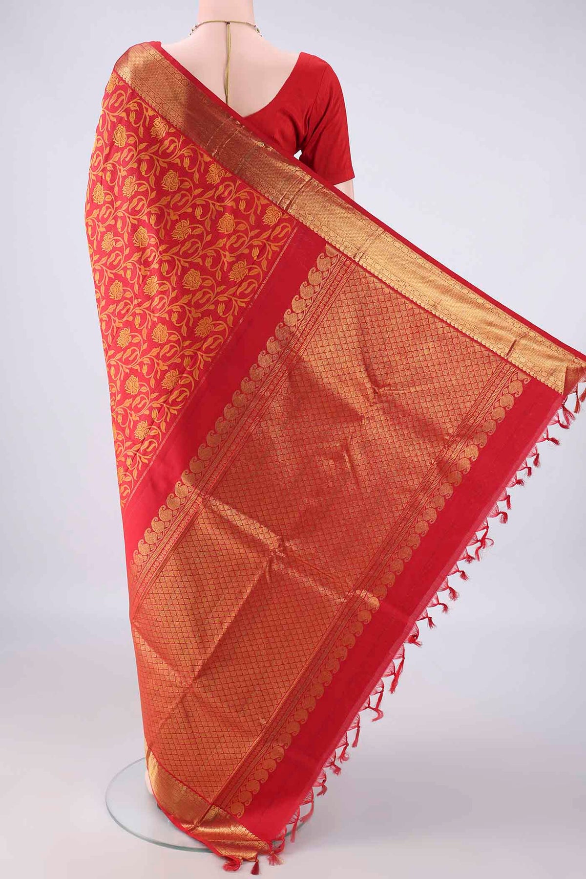 Flat view of Pure Silk Red Kanjivaram Saree with Jacquard design on the body and Zari Border. 