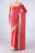 Peach Mysore Crepe Saree with Plain Body and Zari Border.  displayed on a mannequin