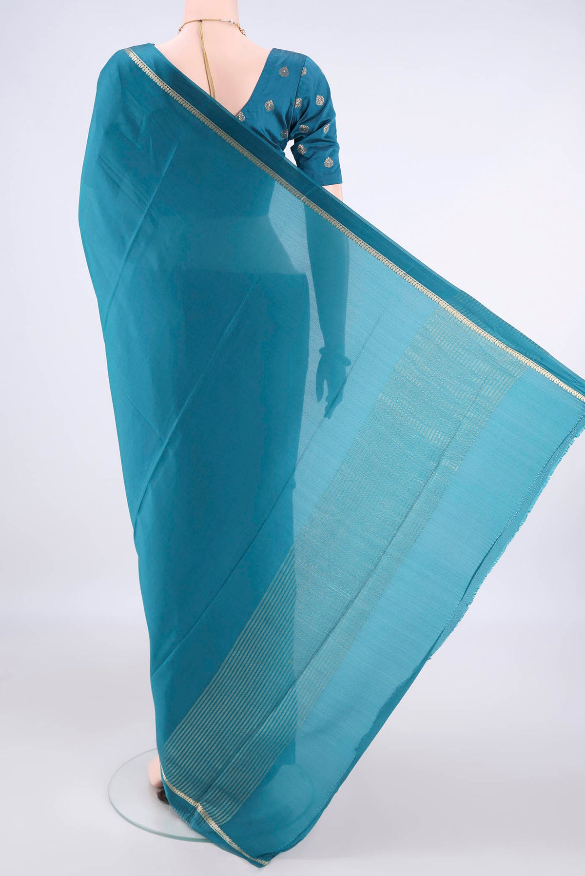 Flat view of Teal Mysore Crepe Saree with Plain Body and Zari Border. 