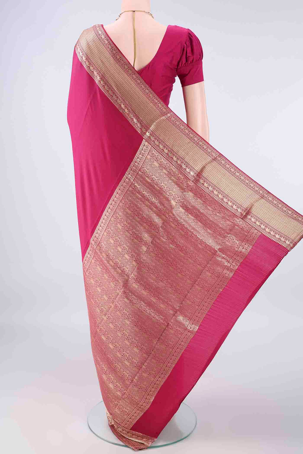 Flat view of Dark Pink Mysore Crepe Saree with Plain Body and Zari Border. 