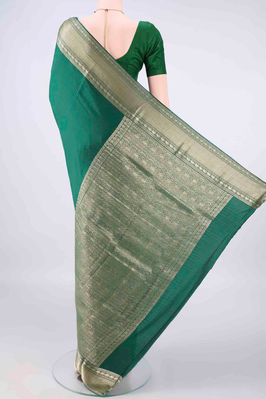 Flat view of Green Mysore Crepe Saree with Plain Body and Zari Border. 