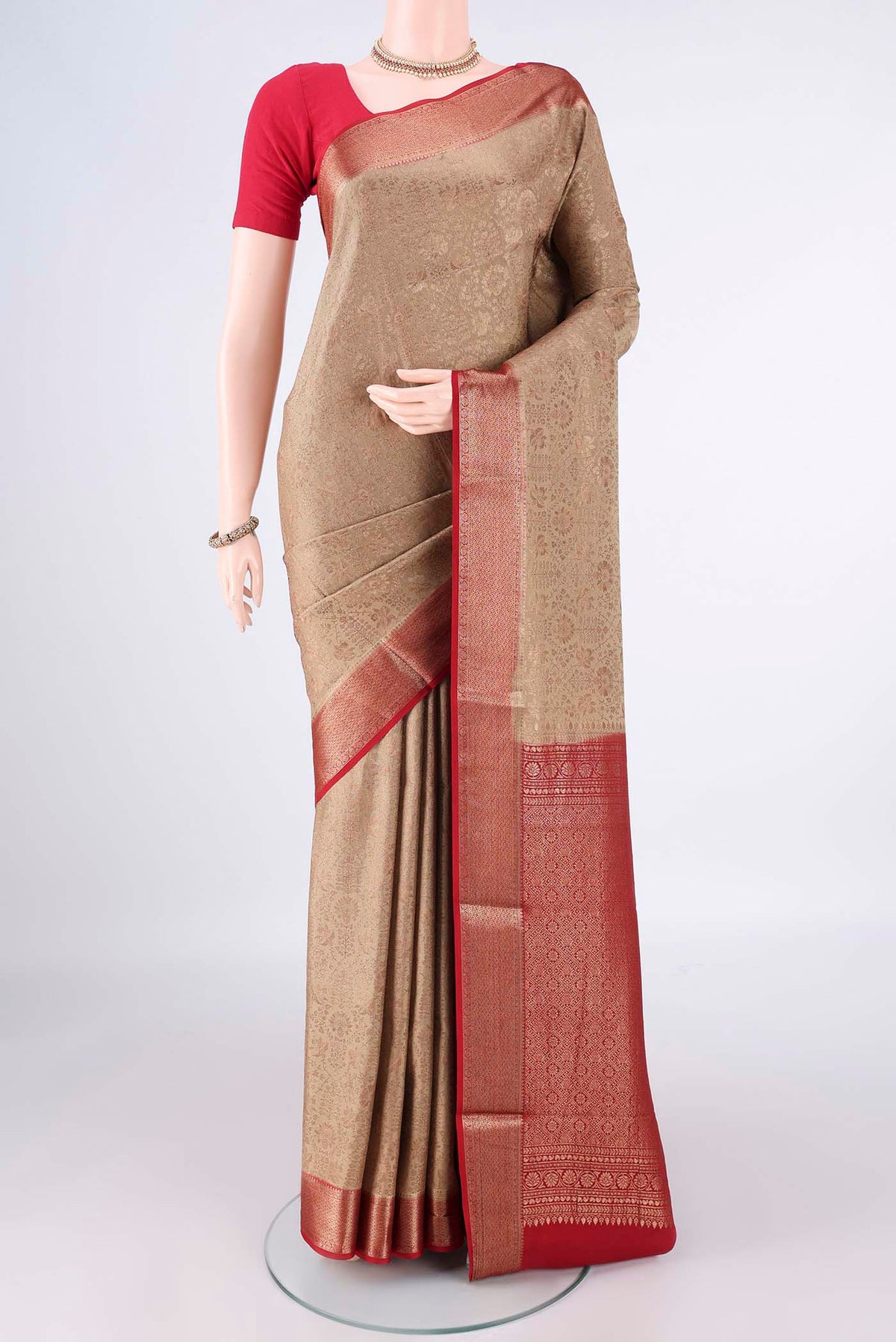Dark Beige Mysore Crepe Saree with Zari Brocade on the body and Zari Border.  displayed on a mannequin