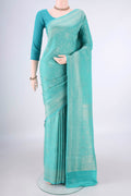 Turquoise Mysore Crepe Saree with Zari Brocade on the body and Zari Border.  displayed on a mannequin