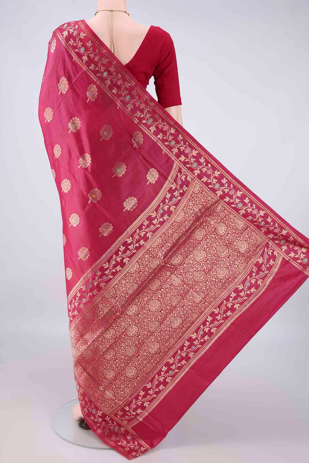 Flat view of Rani Pink Banarasi Tussar Saree with Zari Butta on the body and Zari Border. 