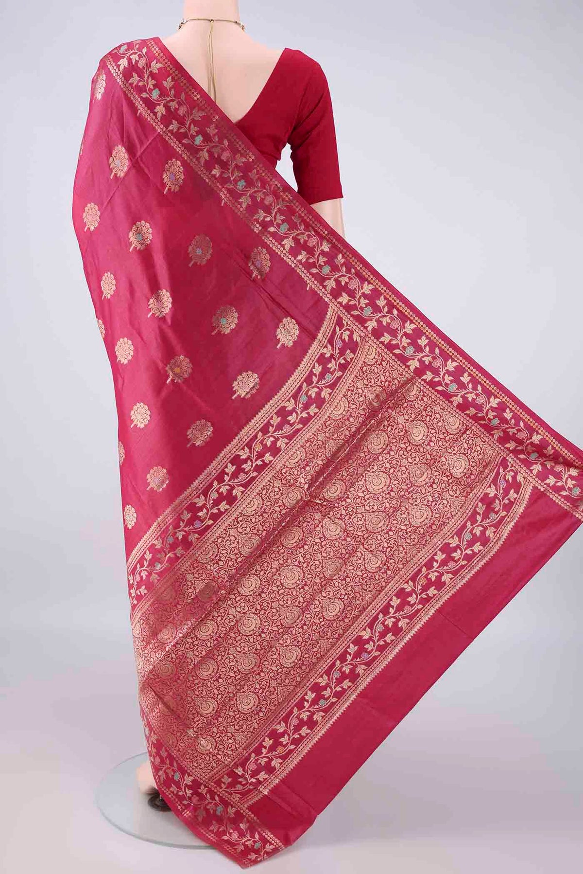 Flat view of Rani Pink Banarasi Tussar Saree with Zari Butta on the body and Zari Border. 